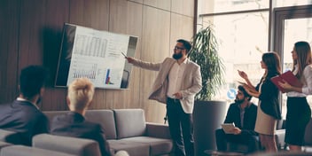 Man presenting at a business meeting.